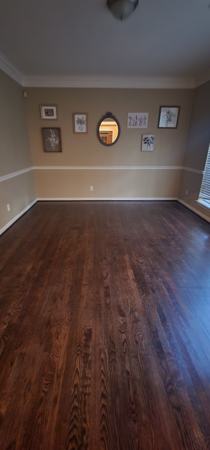 Dark wood flooring in a furnished room
