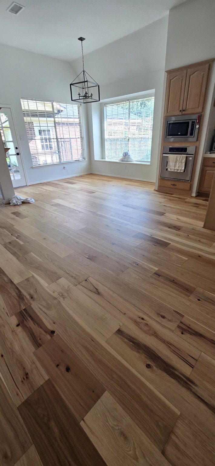 Natural wood flooring in a bright dining room